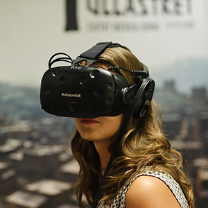 Young woman using a VR headset at an EAA conference