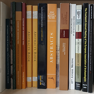 EAA Abstrac Books and other booklets and documents displayed on a shelf